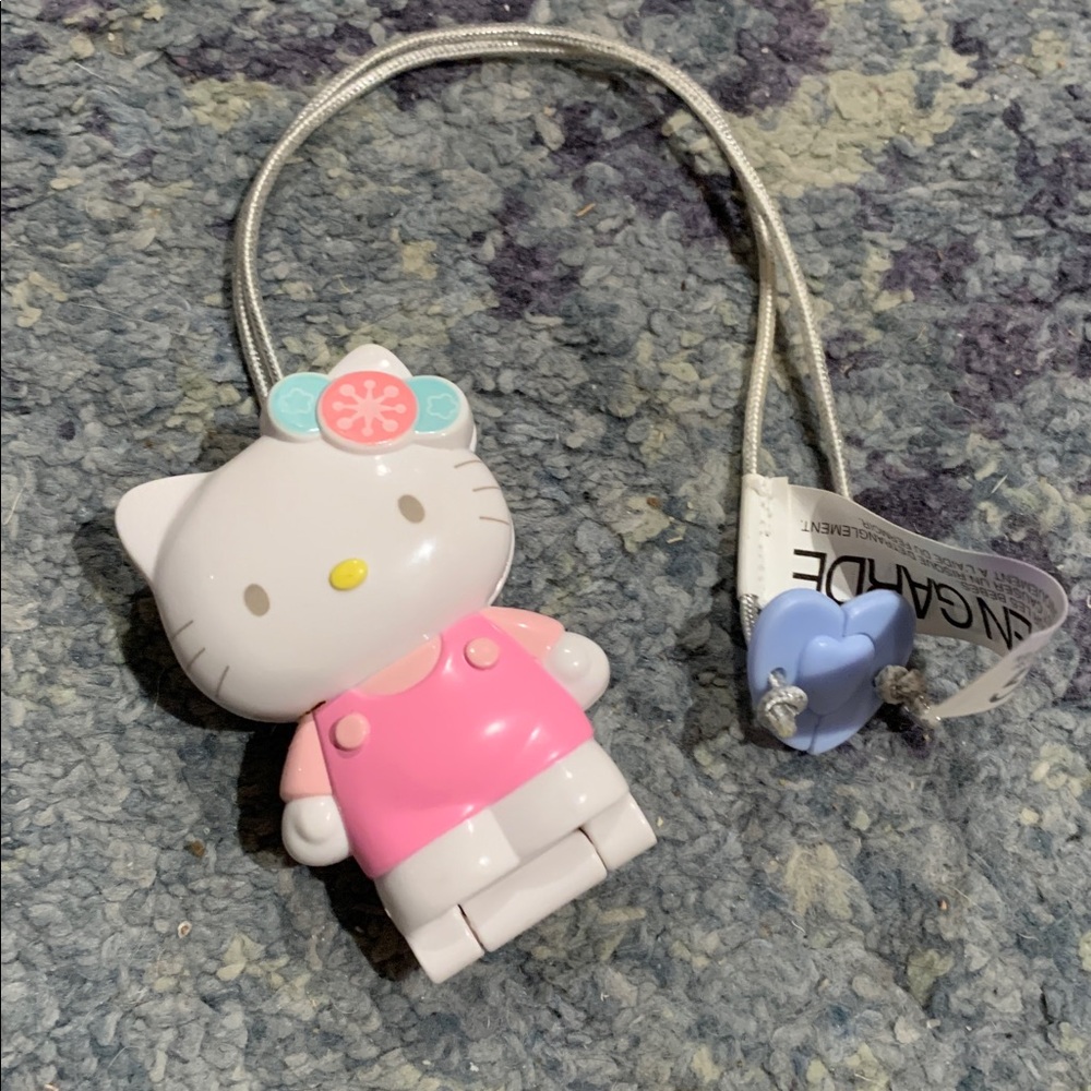 2002 Sanrio Hello Kitty plastic figurine locket on elastic from McDonald’s